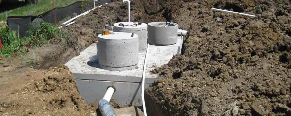 Septic system repair and installation site with tank access ports in Indianapolis, IN