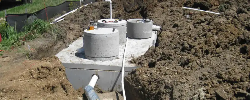 Septic system repair and installation site with tank access ports in Indianapolis, IN