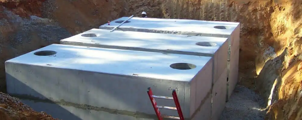 Septic tank installation site with a newly placed concrete tank in Indianapolis, IN